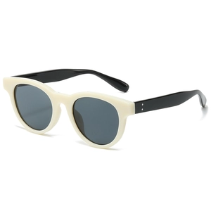Retro round sunglasses with cream white frame, black temples and silver dot accents
