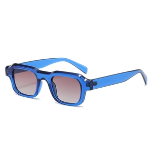 Translucent blue rectangular sunglasses with purple gradient lenses in a modern retro style
