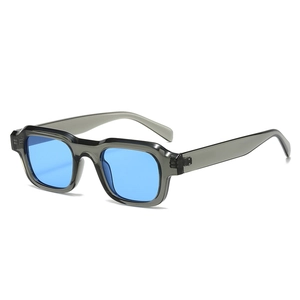 Retro rectangle sunglasses with translucent gray frames and vibrant blue lenses for unisex wear