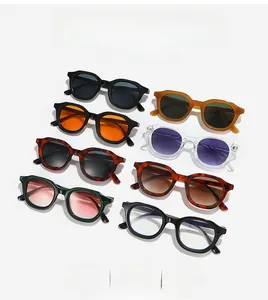 Flat lay of retro oval sunglasses in multiple colors and thick frame finishes