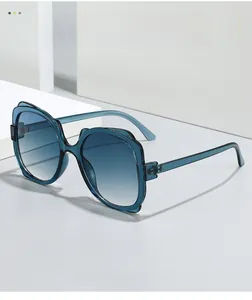Detail of blue transparent butterfly frame and gradient lenses on fashion sunglasses