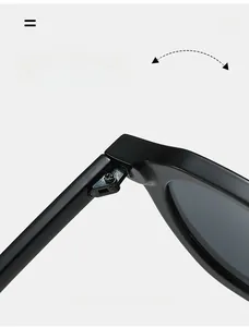 Detailed macro view of the durable metal hinge and polished black frame on sunglasses