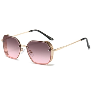 Vintage gold metal sunglasses with oversized gradient pink lenses and mesh side shields