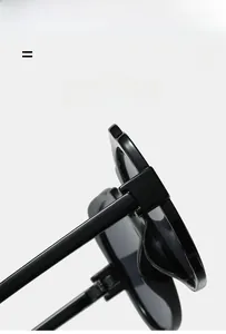 Detail of high-gloss black butterfly sunglasses showing flexible hinges and temple texture