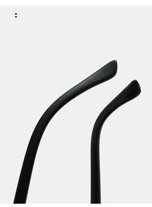 Close-up of ergonomic curved temple legs on glossy black butterfly sunglasses for comfort
