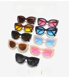 Detailed grid of oversized cat-eye sunglasses in multiple frame colors and tinted lenses