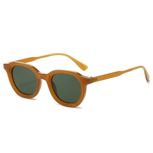 Retro oval sunglasses with amber tortoiseshell frames and dark green lenses