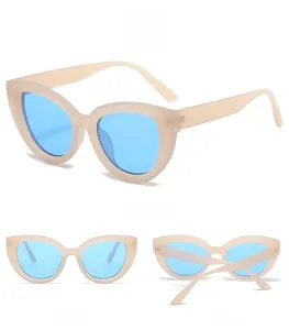 Cat eye sunglasses detail in matte beige frame with vibrant blue lenses in three angles