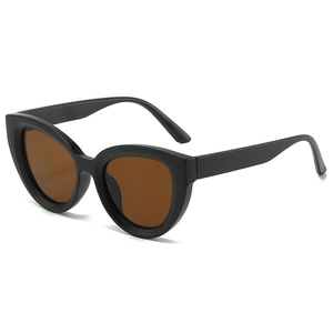 Classic oversized cat eye sunglasses with thick black frames and tinted brown lenses