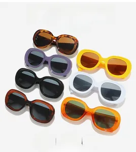 Collection of oval thick frame sunglasses in multiple colors on a clean white background