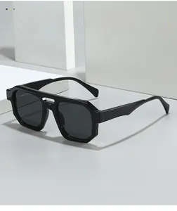Macro detail of high-quality black oversized sunglasses with double bridge geometric frame