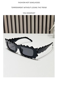 Detail of black irregular wavy edge frames with rectangular lenses on modern sunglasses