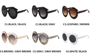 Collection of oversized oval sunglasses in black, tortoiseshell, brown, grey and white