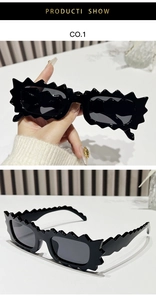 Close-up of black irregular flame-shaped frame sunglasses with glossy finish