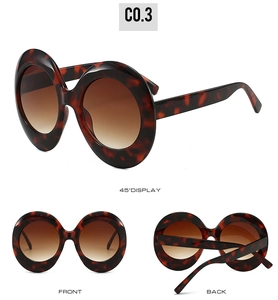 Multi-angle views of oversized oval tortoise shell sunglasses with gradient brown lenses