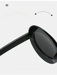 Detail shot of durable metal reinforced hinges on oversized black oval sunglasses