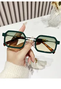 Detail of vintage square glasses with green frames and tortoiseshell temples for eye protection