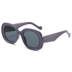 Vintage chunky oval sunglasses with thick purple frames and dark circular lenses