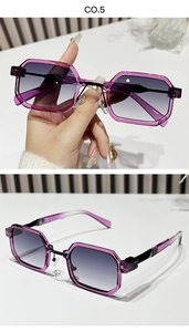 Detail of purple transparent resin sunglasses with square frames and grey gradient lenses