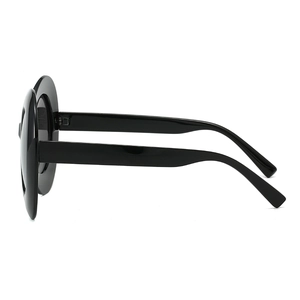 Oversized oval sunglasses with thick black frames and sleek punk alien style design