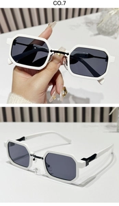Detail view of white geometric hexagon sunglasses with grey lenses and black metal hinges