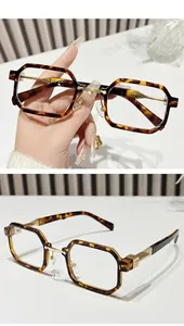Detail of retro small square sunglasses with tortoiseshell frames and gold metal temples