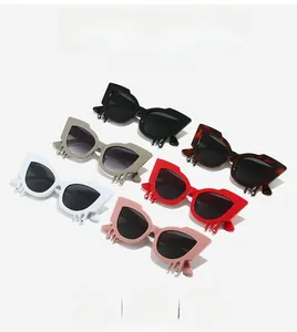 Detail of trendy cat-eye sunglasses featuring unique liquid drip design in six colors