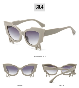 Cat eye sunglasses with liquid teardrop crystal details and purple gradient lenses