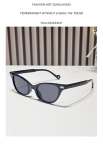 Close-up of hip-hop triangle sunglasses with silver metal hinge detail and dark lenses