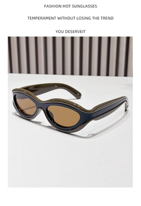 Detailed view of dark green wavy frames with amber lenses on a fashion sunglasses model