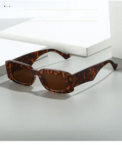 Detail shot of vintage rectangular tortoise sunglasses with dark brown lenses
