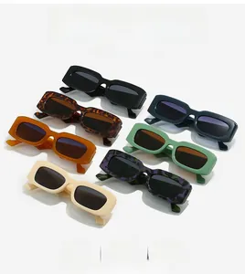 Flat lay of vintage rectangular sunglasses in seven colors including leopard and black
