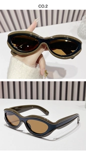 Detail view of retro oval sunglasses with olive green and black dual-color frames
