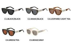 Detail of square oversized sunglasses showing various colors with chain link metal temples