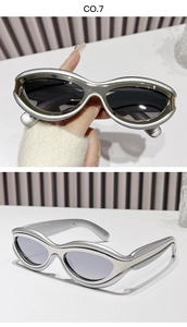 Detail view of oval silver metallic sunglasses with futuristic streamlined frame design