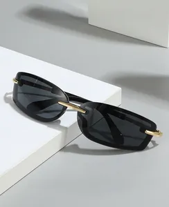 Detail of Y2K square rimless sunglasses with gold metal hinges on white geometric stones