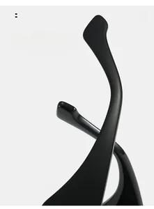 Detail of curved ergonomic temple design for minimalist square black sunglasses