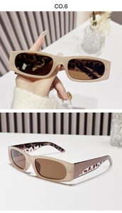 Détail de lunettes de soleil beiges avec motif léopard intérieur et verres marron foncé
