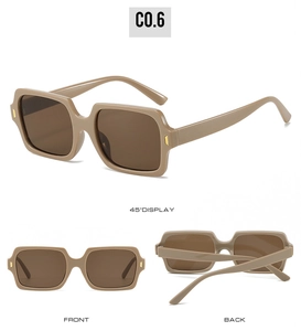 Macro view of khaki square sunglasses with gold metal hinges and brown tinted lenses