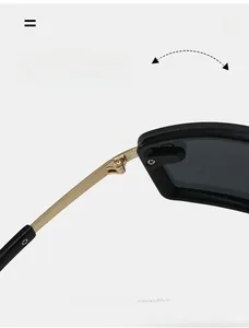 Detail of durable gold metal hinge on square Y2K sunglasses with black matte frame