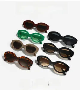 Flat lay of retro oval wide-frame cat-eye sunglasses in various trendy colors and patterns