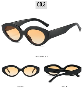 Detailed views of vintage cat eye sunglasses with thick black frames and orange gradient lenses