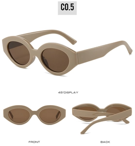 Detail view of oval cat-eye sunglasses with thick tortoiseshell frame and brown lenses