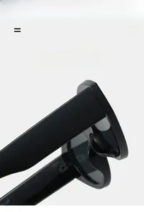 Detail of lightweight cat eye sunglasses showing super elastic hinges and black frame