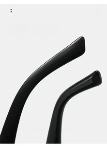 Macro detail of ergonomic curved temples on black cat-eye sunglasses for comfortable wear