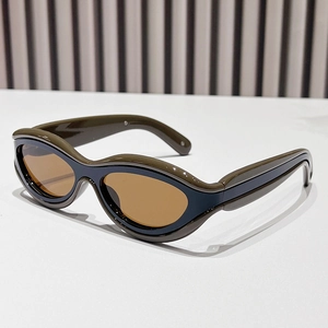Retro cat-eye sunglasses with olive green and blue layered frame and amber tinted lenses
