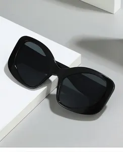 Detail of oversized black square frames on geometric block showing y2k vintage aesthetic