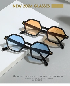 Detail of vintage hexagonal sunglasses with tinted lenses and gold metal temple accents