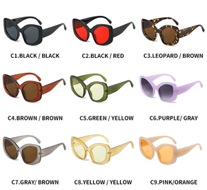Macro shot of nine colorful Y2K oversized sunglasses showing frames in black and pastels