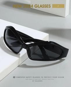 Close-up of futuristic wrap-around glasses on white geometric props with 2024 design